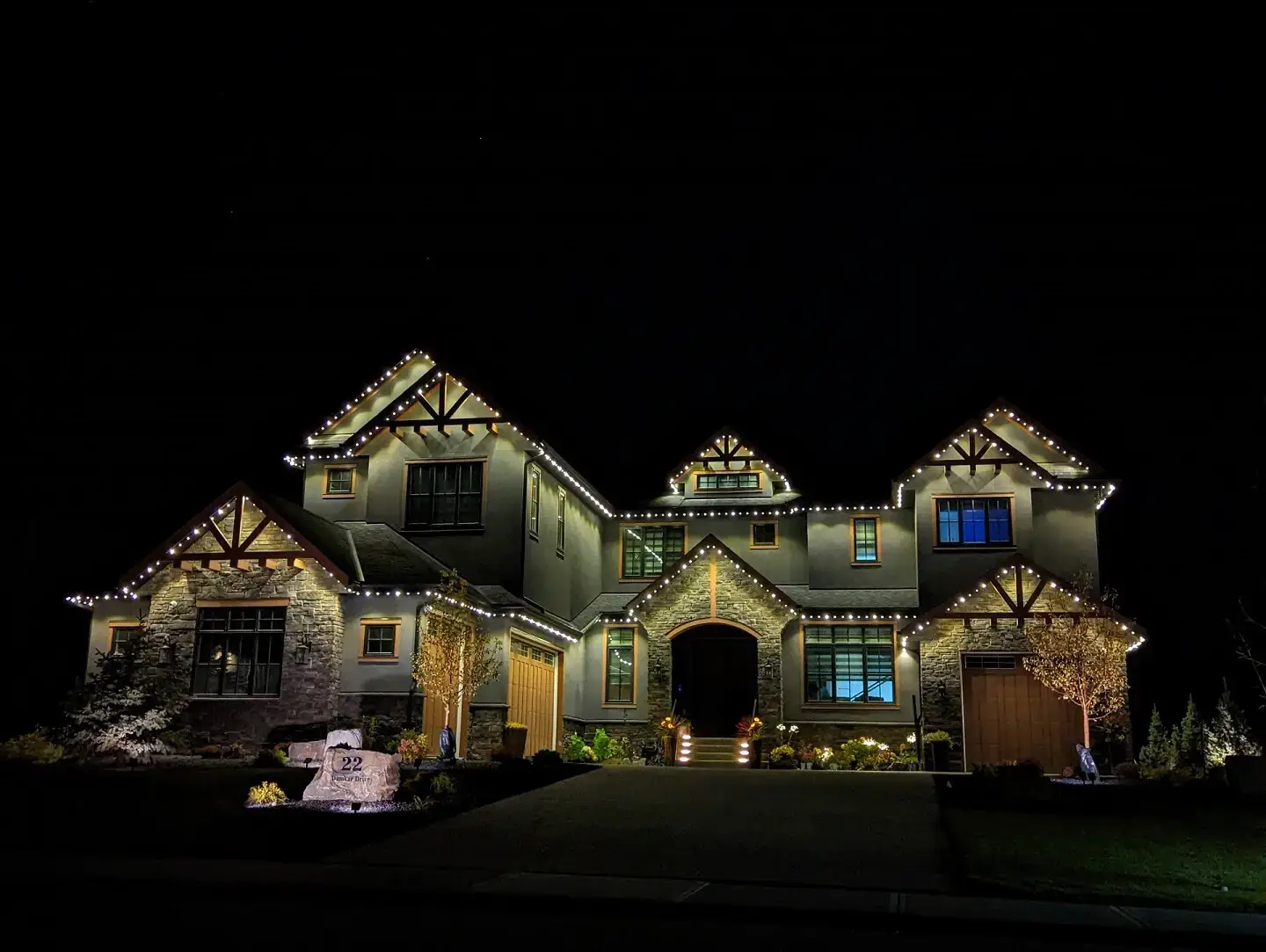 Architectural accent lighting highlighting building features, columns, and exterior design elements for enhanced curb appeal