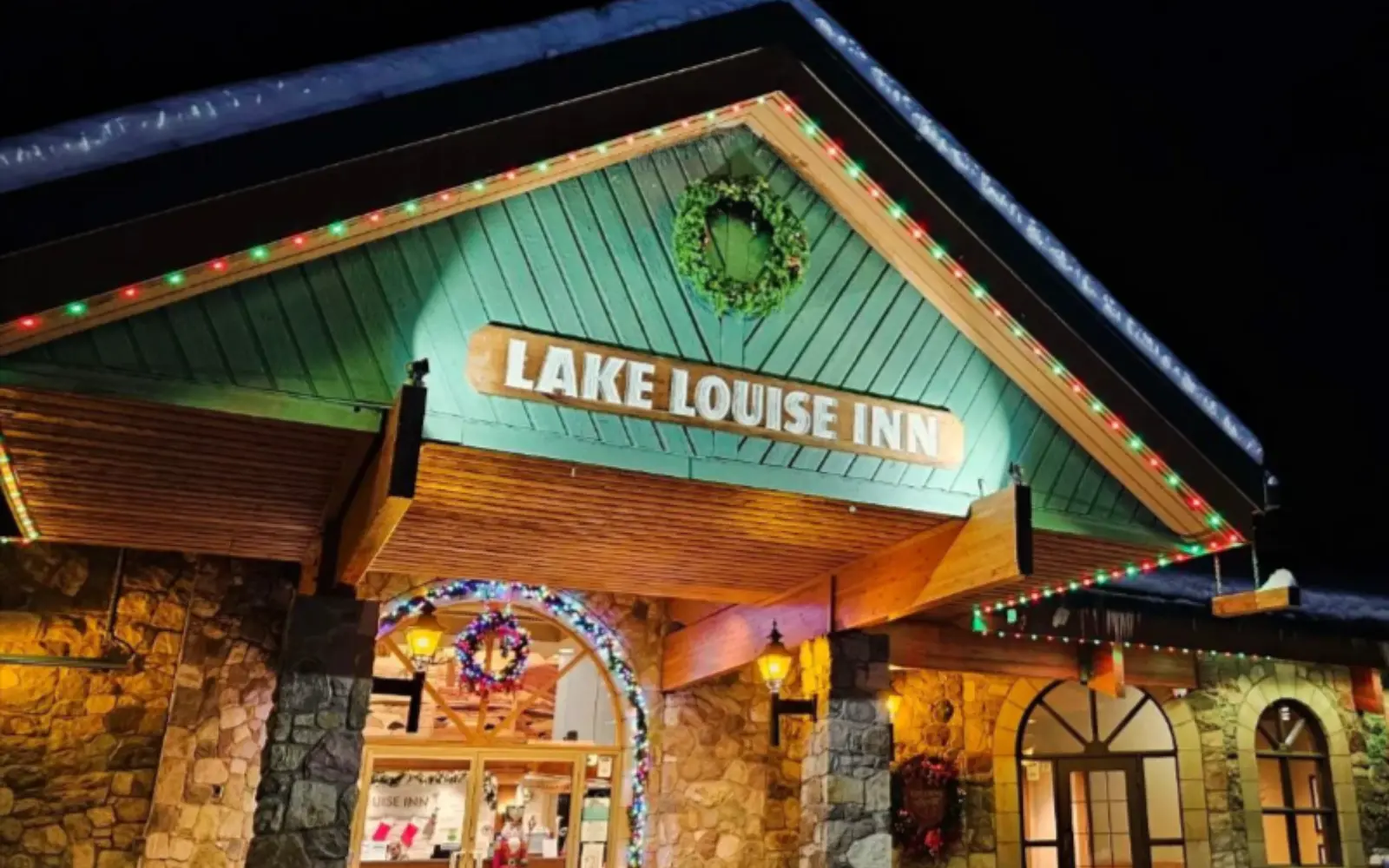 Lake Louise Inn entrance lit with permanent Allure commercial track lighting