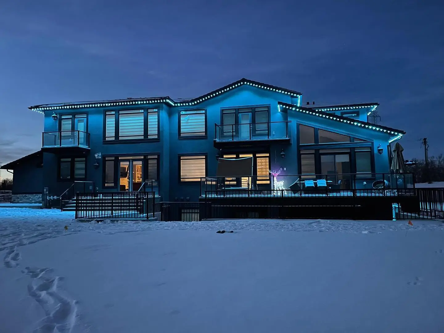 Allure permanent outdoor lighting installation accenting the architecture of a Calgary home at night